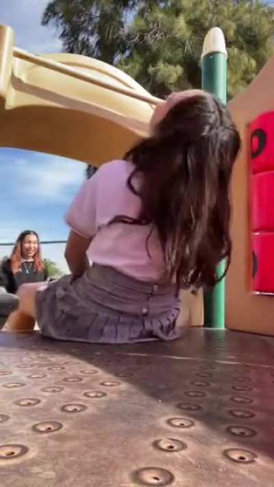 Trying to slide with her friends