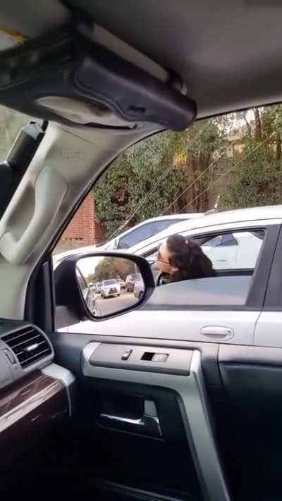 Karen in a car