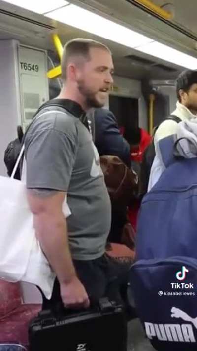 Man preaching to a captive audience on a train gets told off.
