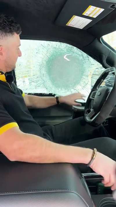 Bullet proof window stops a .50 BMG round.