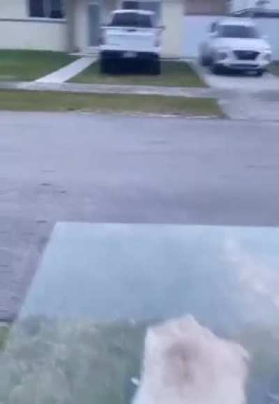 Throwing a concrete slab at a glass desk,