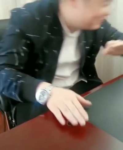 Guy trying to break a walnut