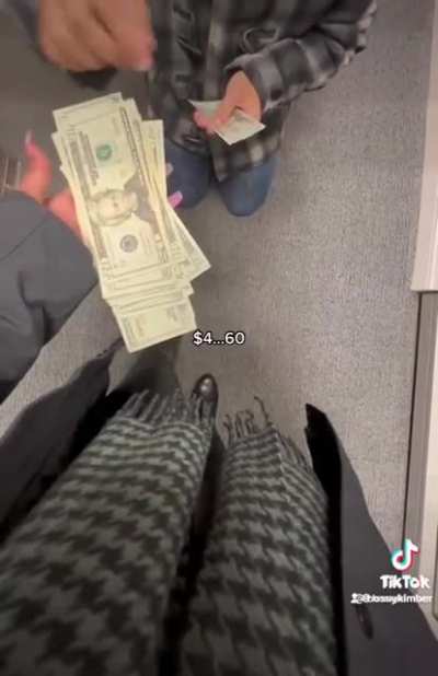 Man on his knees gives money.