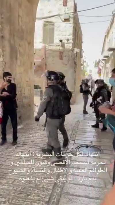 IOF Soldier throwing a flashbang at medics and an ambulance in Jerusalem.