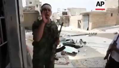 Free Syrian Army (FSA) fighters battle with Syrian Arab Army (SAA, Pro-Assad forces) in the streets of Aleppo, Syria near Salah Al-Din neighbourhood (1st of September, 2012)