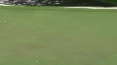 John Rahm skipped a ball across the water hazard to make an amazing hole in one.