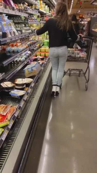 Girl pees her jeans while shopping.