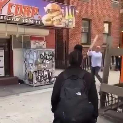 woman threatens Joe Rogan look-a-like w a 2x4 - doesn’t end well for her