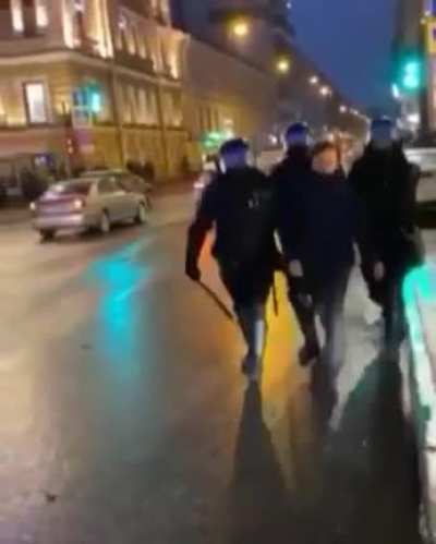 This is from today's protests in Russia. "Tough" Russian policeman kicking old woman in protests