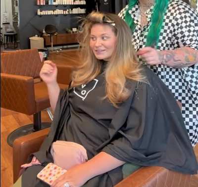 Sorry not much&hellip; just a noticeable belly roll peeking over the elastic waistband of her 4XL pants from underneath the salon tarp