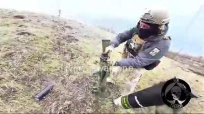 Ukrainian troops using a Carl Gustaf system with HE rounds on a Russian position