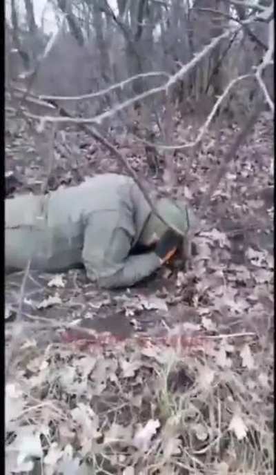 Russian soldier engaging in some tomfoolery with Ukrainian POW who is named Zelensky