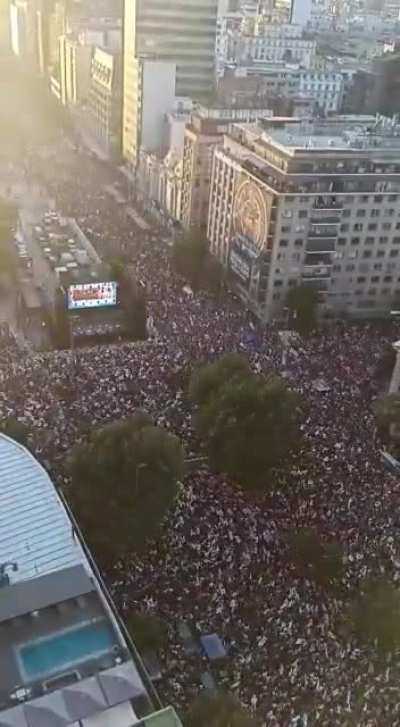 Thousands of people sing 