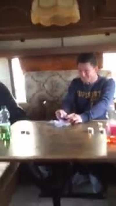 These guys are attempting to eat Surstr&ouml;mming fish, the probably worst smelling fish there is