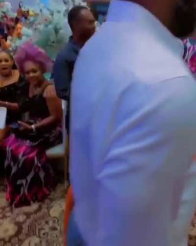 "A group of accompanying women with giant penises and balls accompanied Nigerian businessman Mike Nwogu to the funeral of his friend's mother."