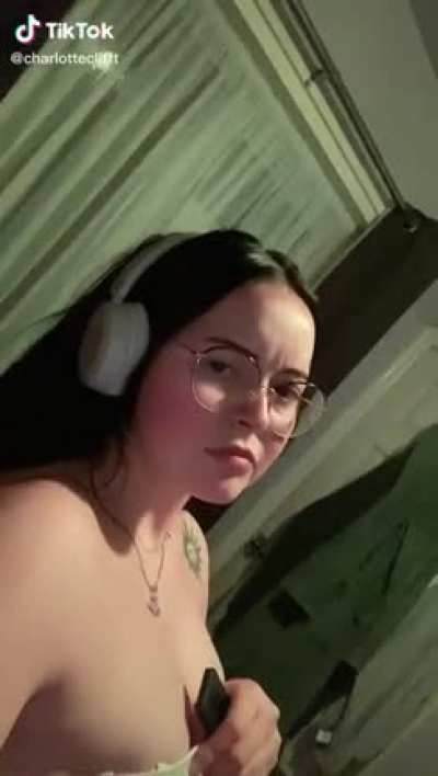 Caption: “I promise there is no nip slip” comments: “This too much?”, she knows