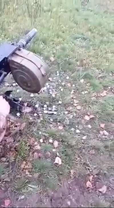 Ukrainian soldiers using grenade launcher alongside drone operator to target Russian position. 2022