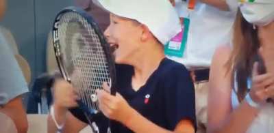 This kid&rsquo;s reaction on getting racket from Novak Djokovic after historic French Open win today