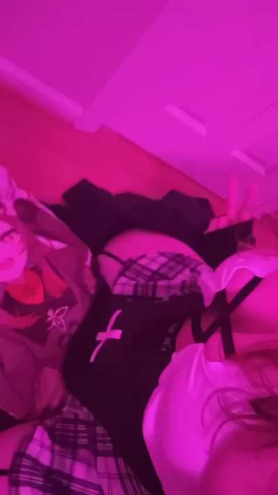 Cosplaying a nun with my hu tao pillow :3