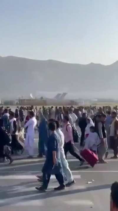 Latest images from Kabul Airport as passengers continue to swarm the tarmac, hoping to board an evacuation flight