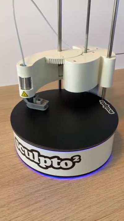 Polar printer with a spinning build platform
