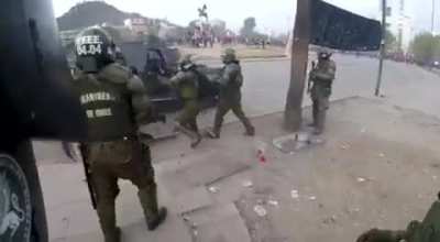 Police girl getting hit by a molotov during protest in Chile.