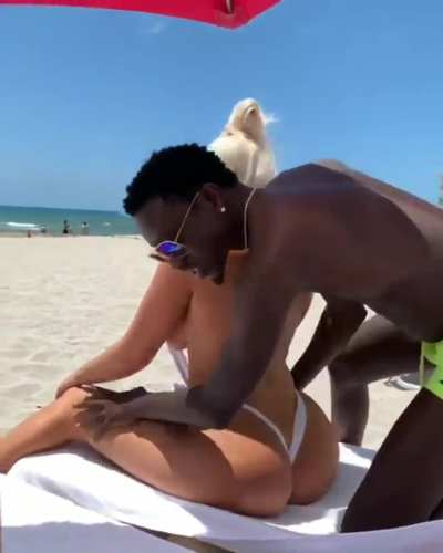 Big tit bimbo at the beach