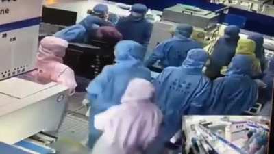 Chinese Workers Stand Still Like Robots While Fellow Co-Worker Tries To Kill Another Assassin&rsquo;s Creed Style!