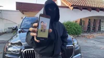 Ye shows a reporter a picture on his phone - a drawing of Hitler and Einstein shaking hands