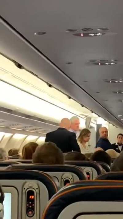 Man demands handshake on airplane