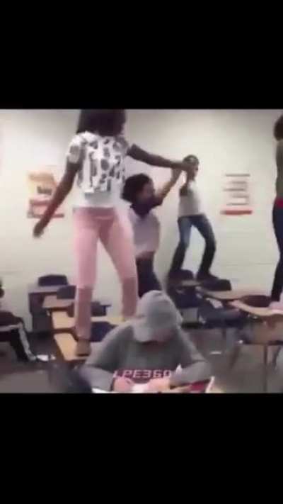 Dancing girl knocked off school desk
