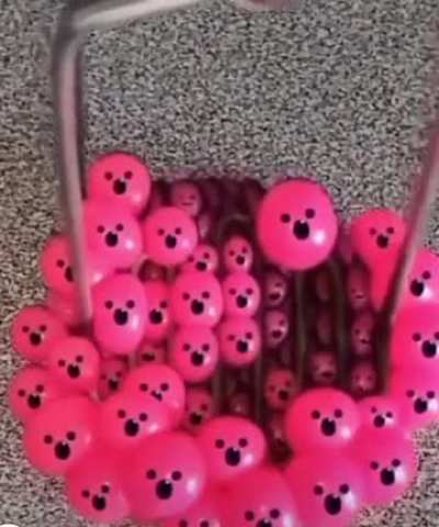 Satisfying smiley face musical squeeze ball