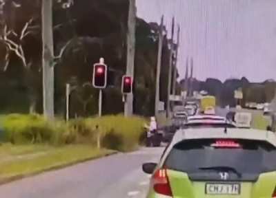 Going through a red light.