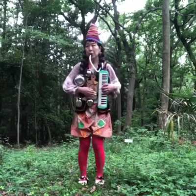 This one-woman-band performing "Tequila"