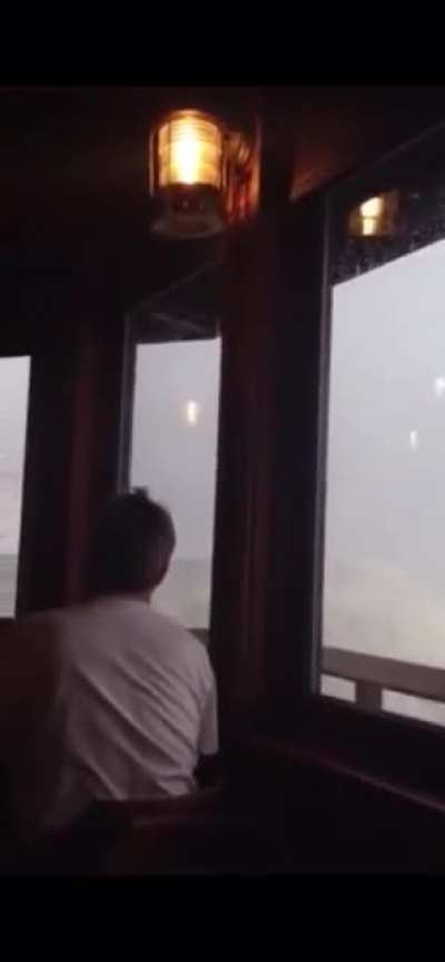 Wave breaks through restaurant