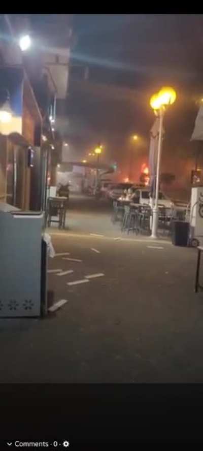 Man Is Unfazed By Missile Strike. Continues To Eat At Table On Sidewalk. "This is fine."