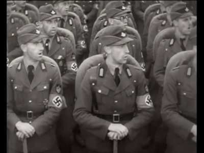 Footage from the propaganda film &ldquo;Triumph of the Will&rdquo;, 1935. The Reich Labor Service has an outdoor rally at Nuremberg, presenting in front of Hitler and other Nazi officials.