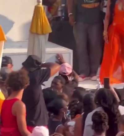 Cardi B gets drink thrown on her onstage, she throws the microphone at the person... the vocals don't stop