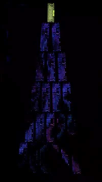 Built a giant RGB keyboard Christmas tree and synced them all. 60% keyboard as the star.