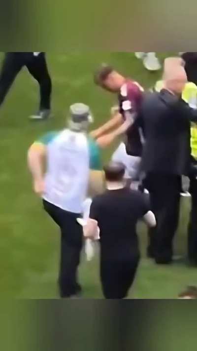 Hearts player smashes pitch invaders phone