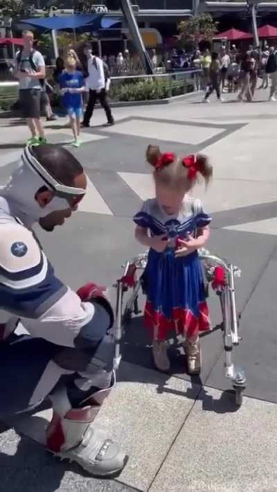 Meeting her hero at Disneyland.