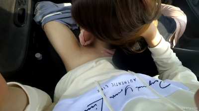 Brunette gives POV blowjob in a car
