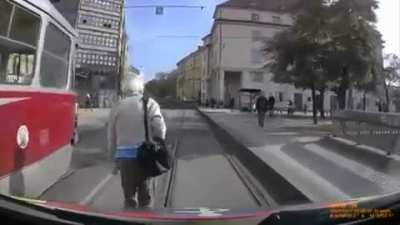 Pedestrian blocks and flips off an ambulance transporting patient with severe breathing problems