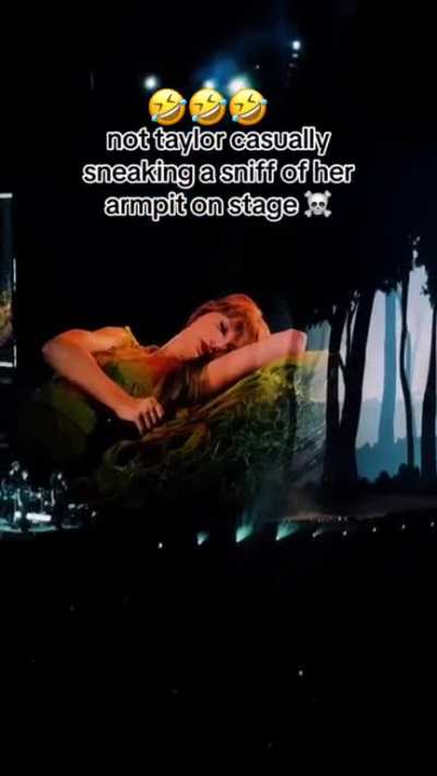 Taylor Swift sniffing her armpit