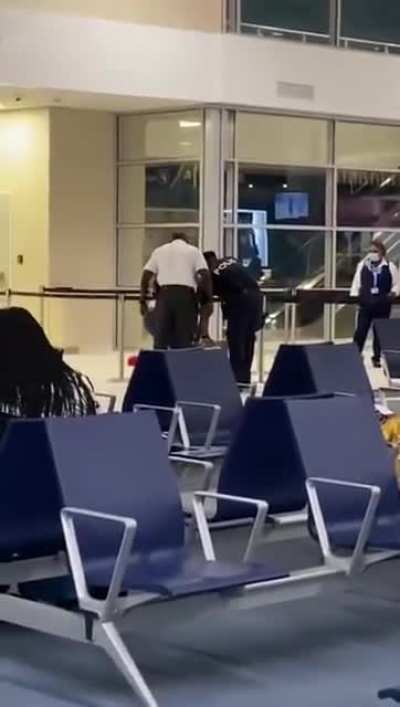 Dutch rapper gets slapped hard at an airport in Cura&ccedil;ao. It's rumoured that he faked his PCR test.