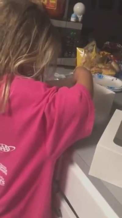 A parent sneaking up on their daughter