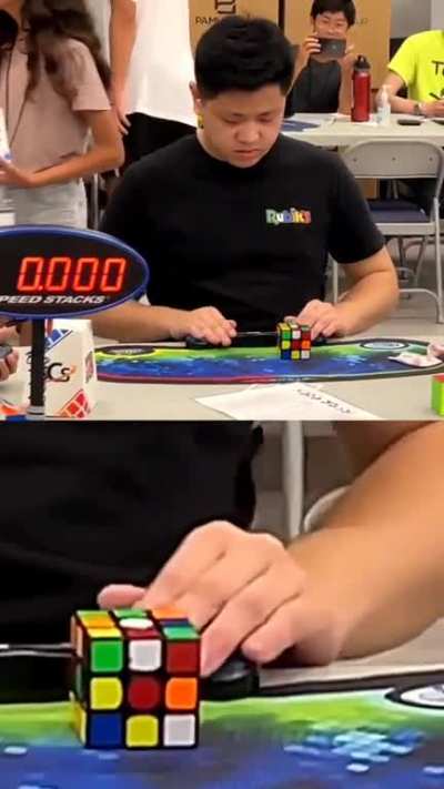 Max Park solving a 3&times;3 Rubik's cube single-handed in a World Record 6.2s. He's so much in the momentum that he immediately picks up another cube on the table after he's done with the target.
