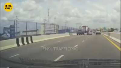 Guy tries to squeeze between two cars