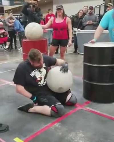 Handicapped man doing the Atlas Stones at Arnold Schwarzenegger&rsquo;s Disabled Strongman competition