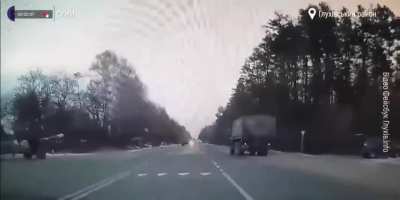 On the first day of the Russian invasion, a lone Russian BTR deep inside of Ukraine unexpectedly runs into the Ukranian military and opens fire on the move, almost hits a civillian.